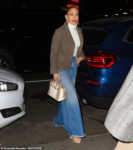 Jennifer Lopez looks stylish in cropped turtleneck sweater and flared jeans as she enjoys dinner with friend in New York