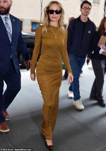 Nicole Richie stuns in a skintight gold dress for appearance on The Kelly Clarkson Show in NYC to discuss new film