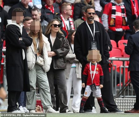 Rio and Kate Ferdinand take son Cree to his first football match to watch Manchester United in the FA Cup semi final.