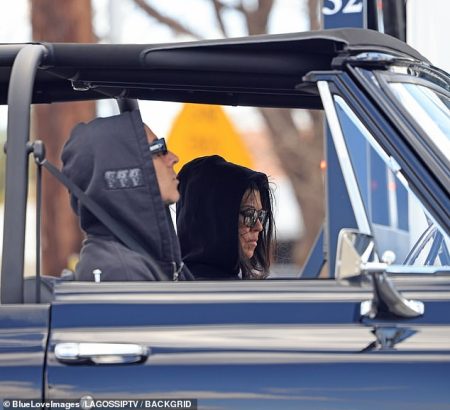 Kourtney Kardashian takes the wheel of a classic Chevy K5 Blazer truck for a coffee run in Calabasas with husband Travis Barker by her side.