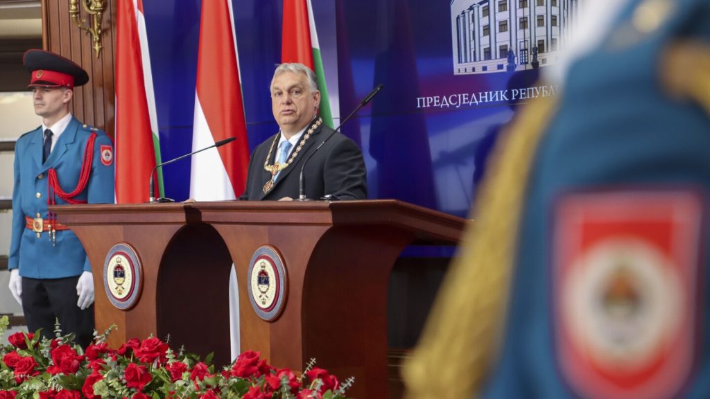 Pro-Russia Bosnian Serb President Dodik awards Hungarian Prime Minister Viktor Orban with a medal
