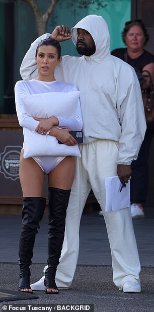 Bianca Censori, wife of Kanye West, covers up with a pillow in a thong bodysuit during their return to Italy, reviving a bold look.