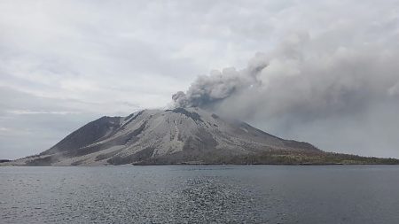 Ruang volcano in Indonesia continues to emit hot clouds following recent eruption, causing closure of schools and airports