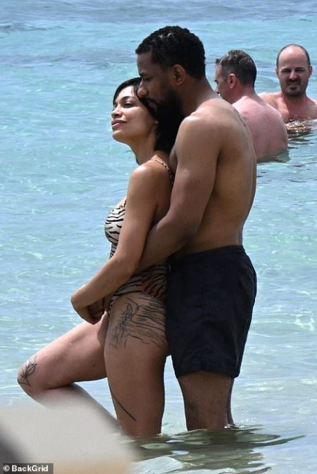 Rosario Dawson, 45, showcases stunning new thigh and leg tattoos during romantic beach getaway with boyfriend Adama Sanneh in Sardinia