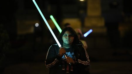 Star Wars enthusiasts in Mexico City practice lightsaber techniques at Jedi academy