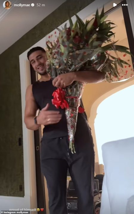 rewrite this title Tommy Fury gifts fiancée Molly-Mae Hague a bouquet of red roses to mark their first engagement anniversary – after quashing split rumours