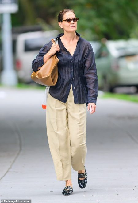 Katie Holmes flaunts chic style in sheer black blouse during NYC outing before daughter Suri Cruise’s Labor Day break from CMU