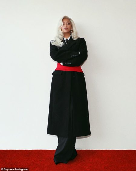 Beyonce opts for a chic black coat and shirt with tie in latest photos, showing off her stylish side.