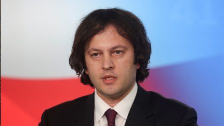 rewrite this title Georgian PM praises country's protest crackdown despite US condemnation