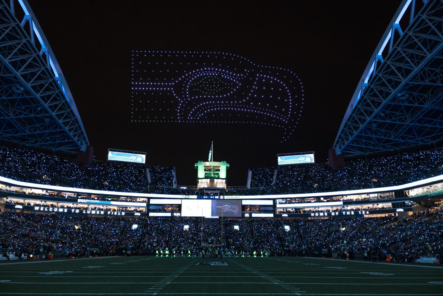 rewrite this title Mysterious drone flights have been in the news, but Seattle Seahawks show was planned tribute to fans