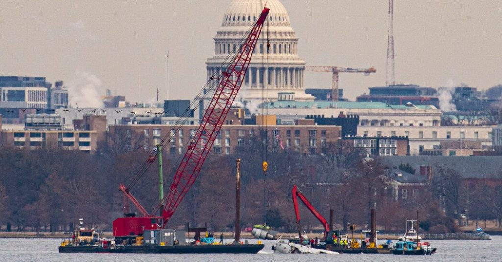 rewrite this title Crews Lift First Wreckage From D.C. Plane Crash Out of Potomac