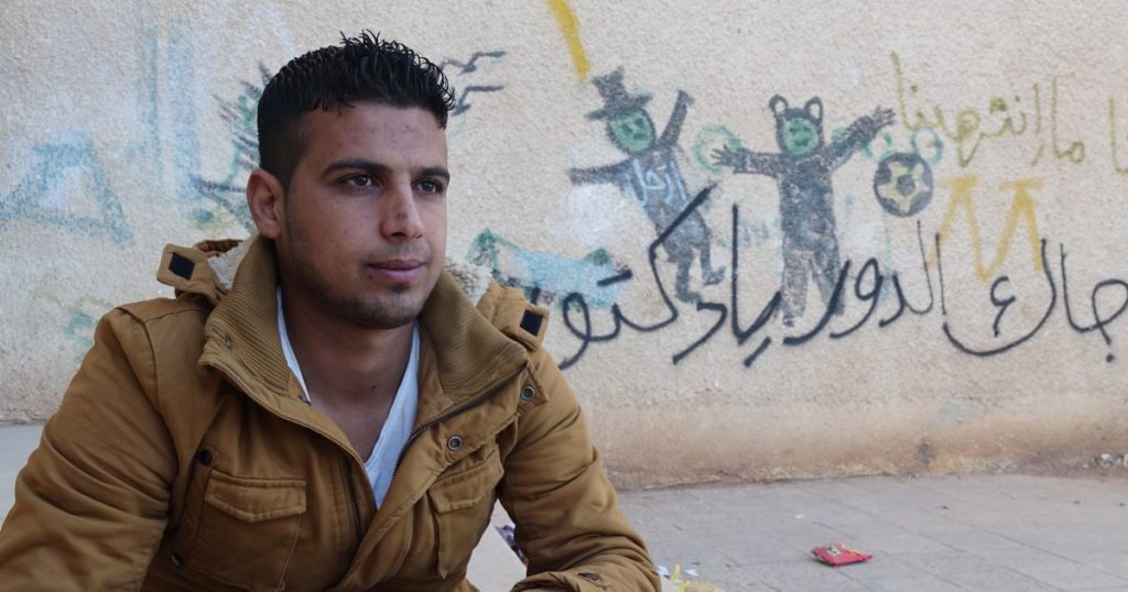 rewrite this title The Syrian teenager who sprayed four words on a wall and started an uprising