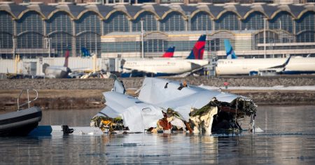 rewrite this title American Airlines engine lifted from Potomac in effort to recover all victims of D.C. midair collision