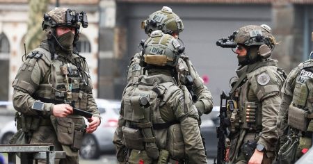 rewrite this title Belgian police hunt for armed gunmen after shooting in Brussels