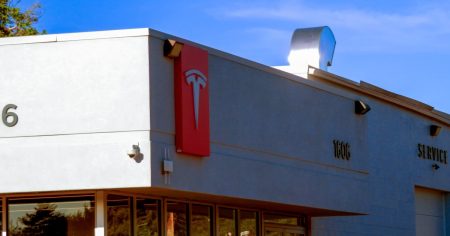 rewrite this title Woman arrested following fourth vandalism incident at Colorado Tesla dealership