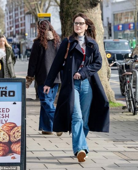 rewrite this title Michelle Dockery cuts a stylish figure in chic trench coat as she hints she is working on a new project after leaving meeting in London