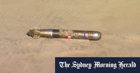 rewrite this title Navy torpedo washes up on Gold Coast beach, sparking lockdown