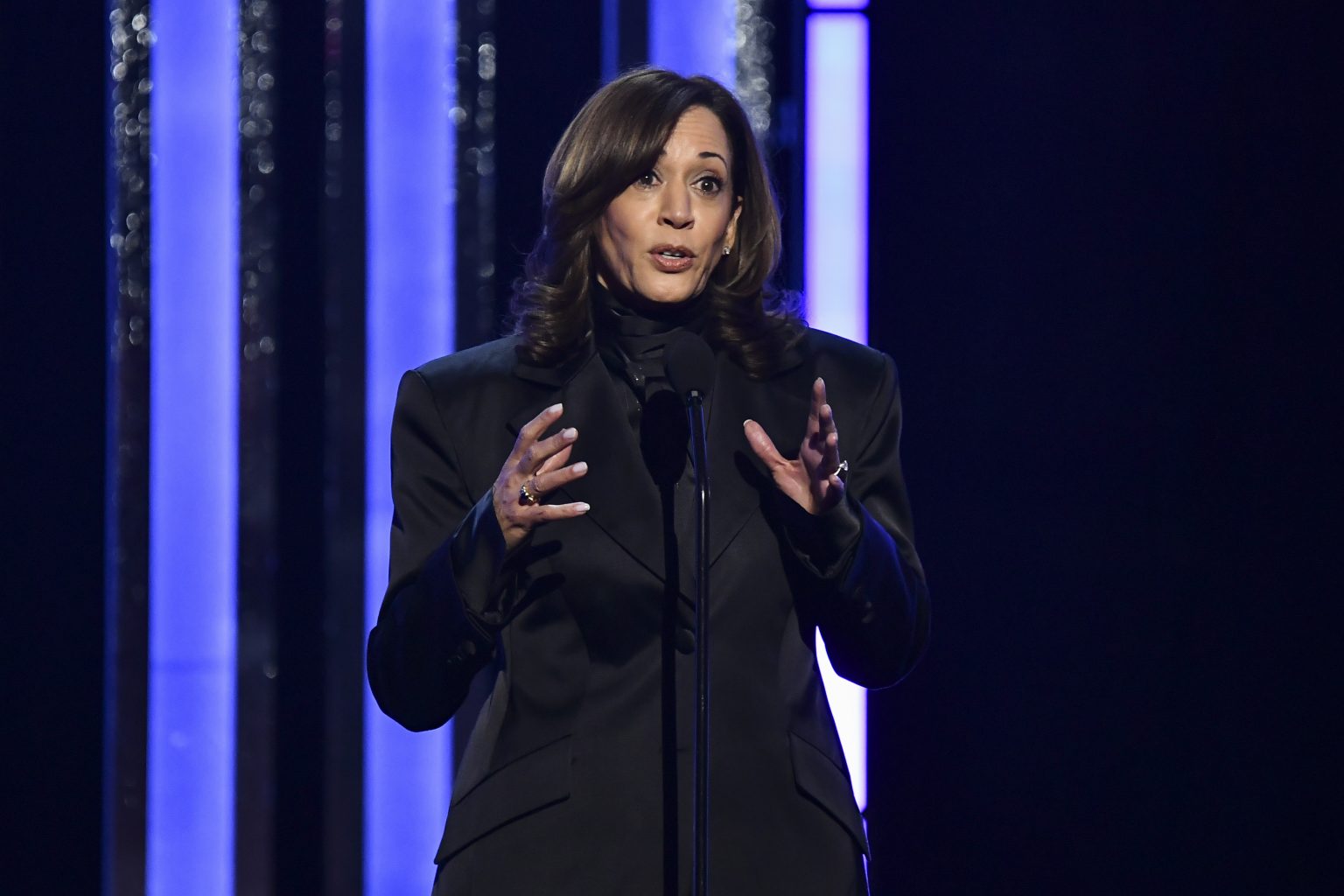 rewrite this title Kamala Harris Takes On Trump and Musk at NAACP Awards: ‘Shadows Gathering’