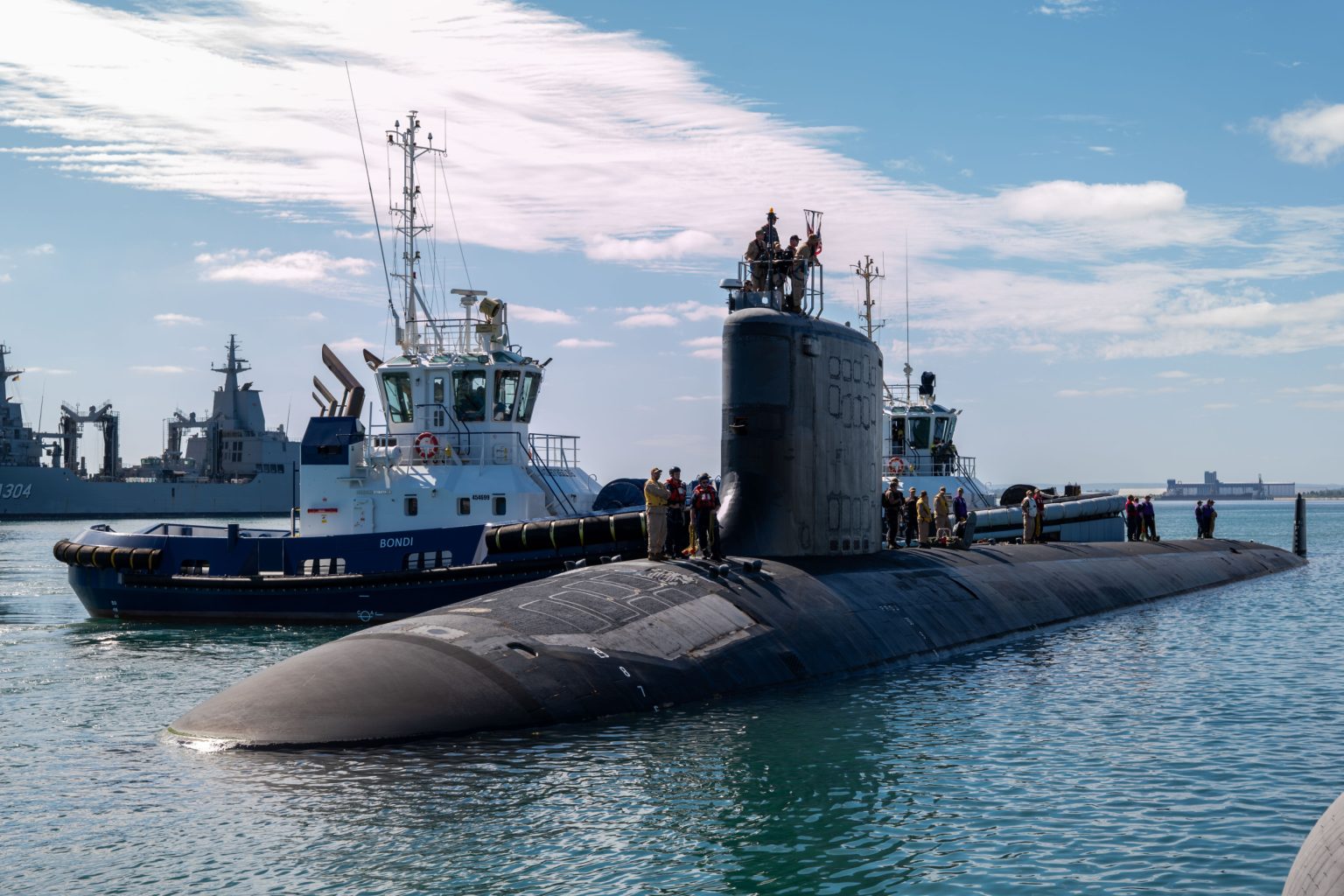 rewrite this title US Sends Submarine To Ally Australia As Chinese Naval Flotilla Operates Near Coast