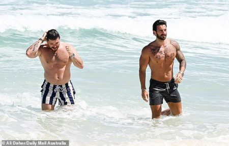 rewrite this title Married At First Sight grooms Eliot Donovan and Paul Antoine show off their chiseled physiques as they take a dip in the ocean