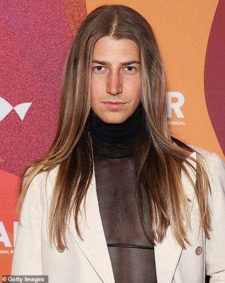 rewrite this title Richard Wilkins’ son Christian unveils dramatic transformation: Model and aspiring actor sports deep tan and shows off striking facial features at beauty event