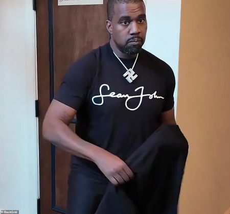 rewrite this title Disgraced Kanye West claims he regrets getting Kim Kardashian pregnant in unhinged interview wearing KKK hood