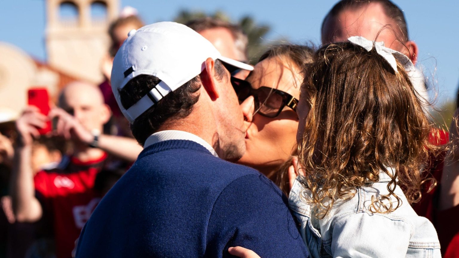 rewrite this title Rory McIlroy and wife, Erica, share celebratory kiss at Players Championship as divorce drama seems in past